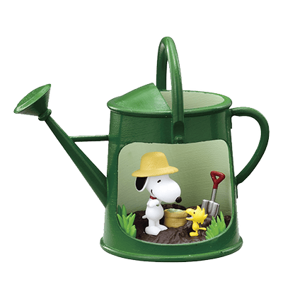 A transparent PNG of Snoopy and Woodstock lounging in a watering can with yellow gardening hats.