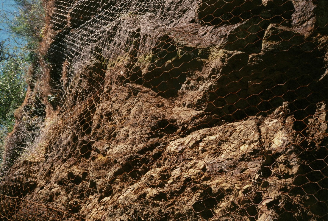 A rock face is held under chicken wire near Montemor-o-Novo in Portugal