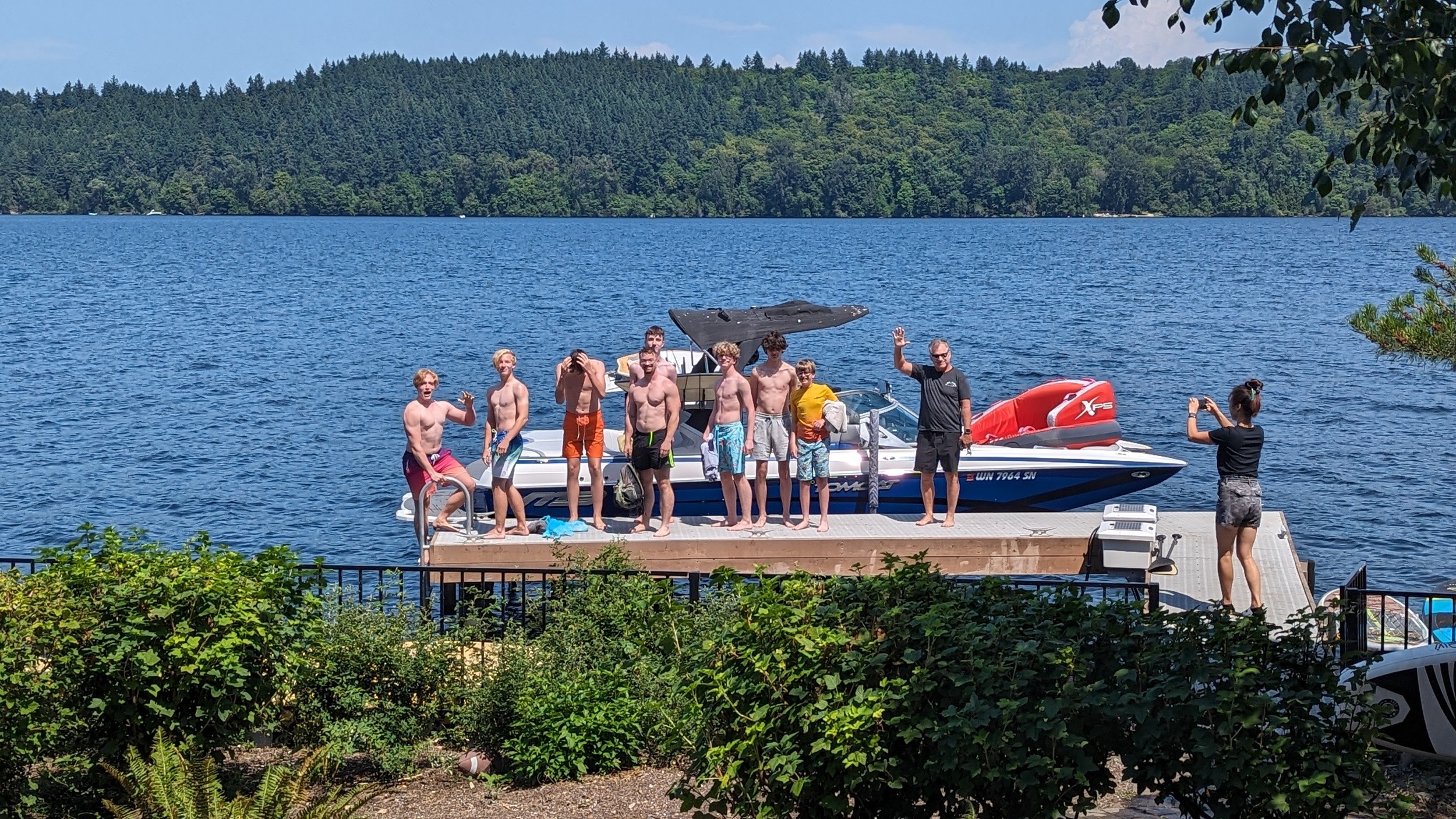 northwest youth group, teens next to a boat